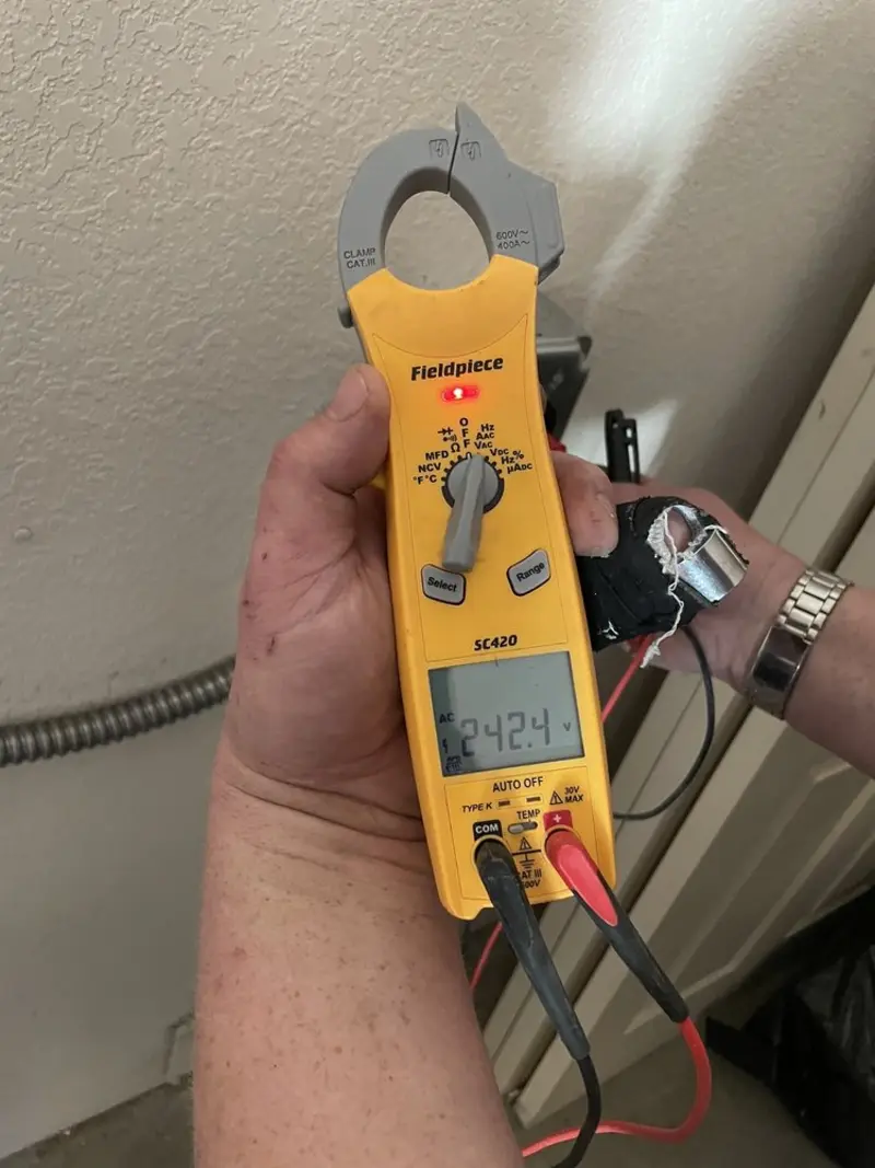 Voltage testing with clamp meter during Generator Installation in Fulton
